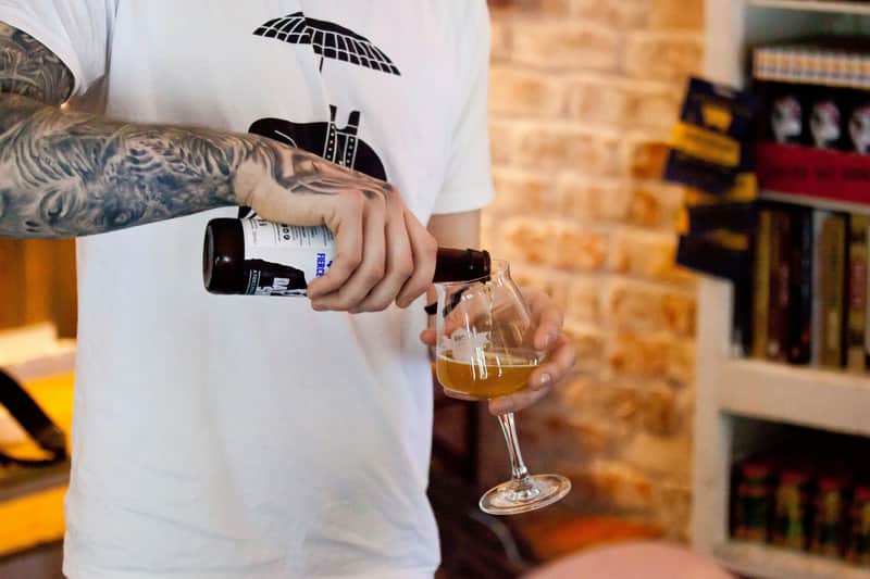 Pouring beer into a tasting glass